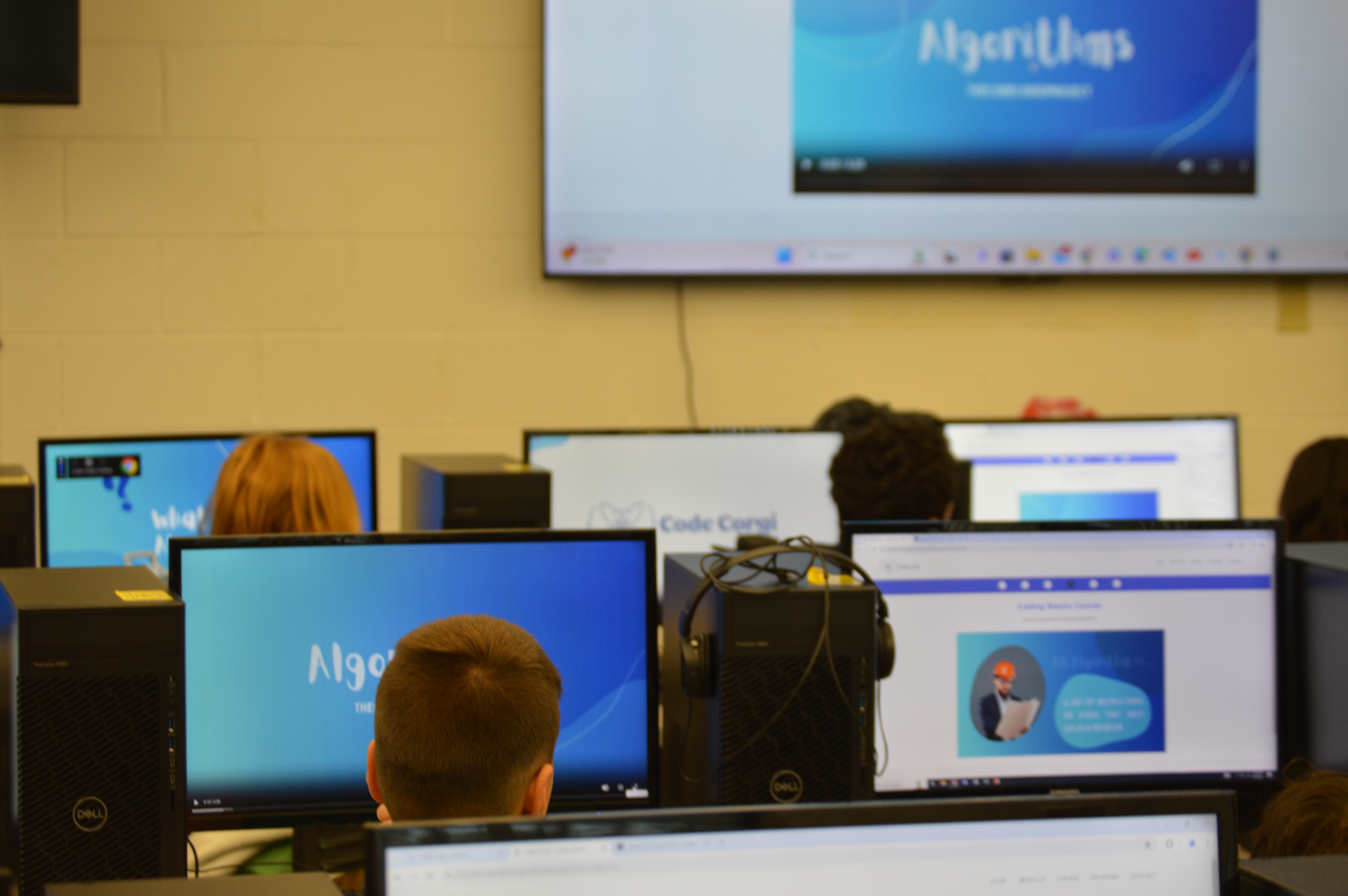 children watching a video on algorithms